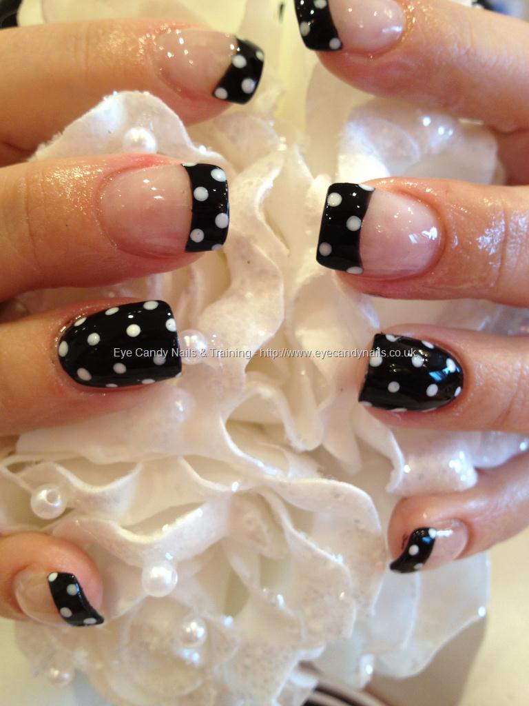 Black polish with white polka dot nail art, that was Repinned 96K times on Pinterest